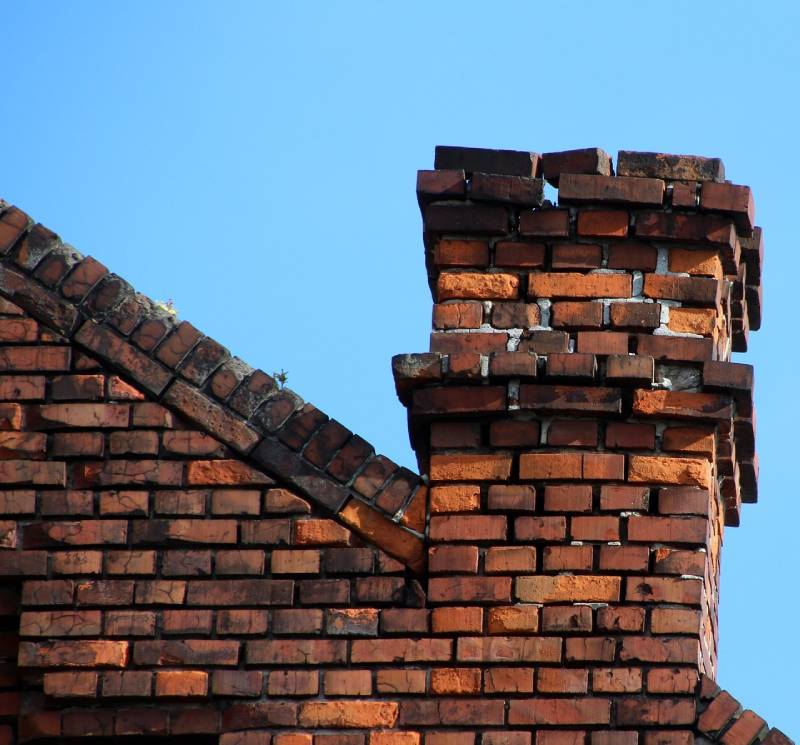 Signs Your Bellflower Home Needs a Chimney Inspection Damaged chimney on an Bellflower home showing cracks and missing mortar